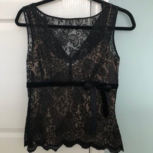 Black lace sleeveless top w/ tan camisole tank.